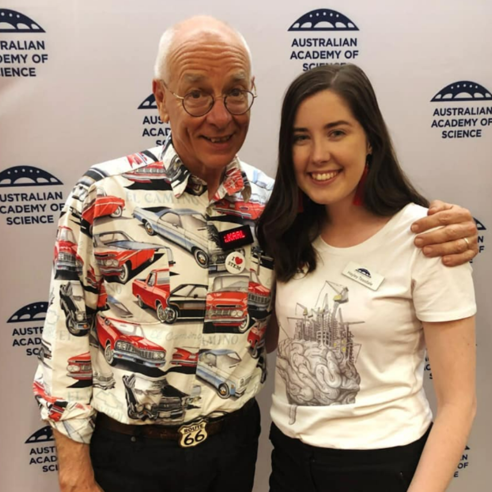 Dr Karl standing with Dr Hayley in her Rebuild Your Brain shirt